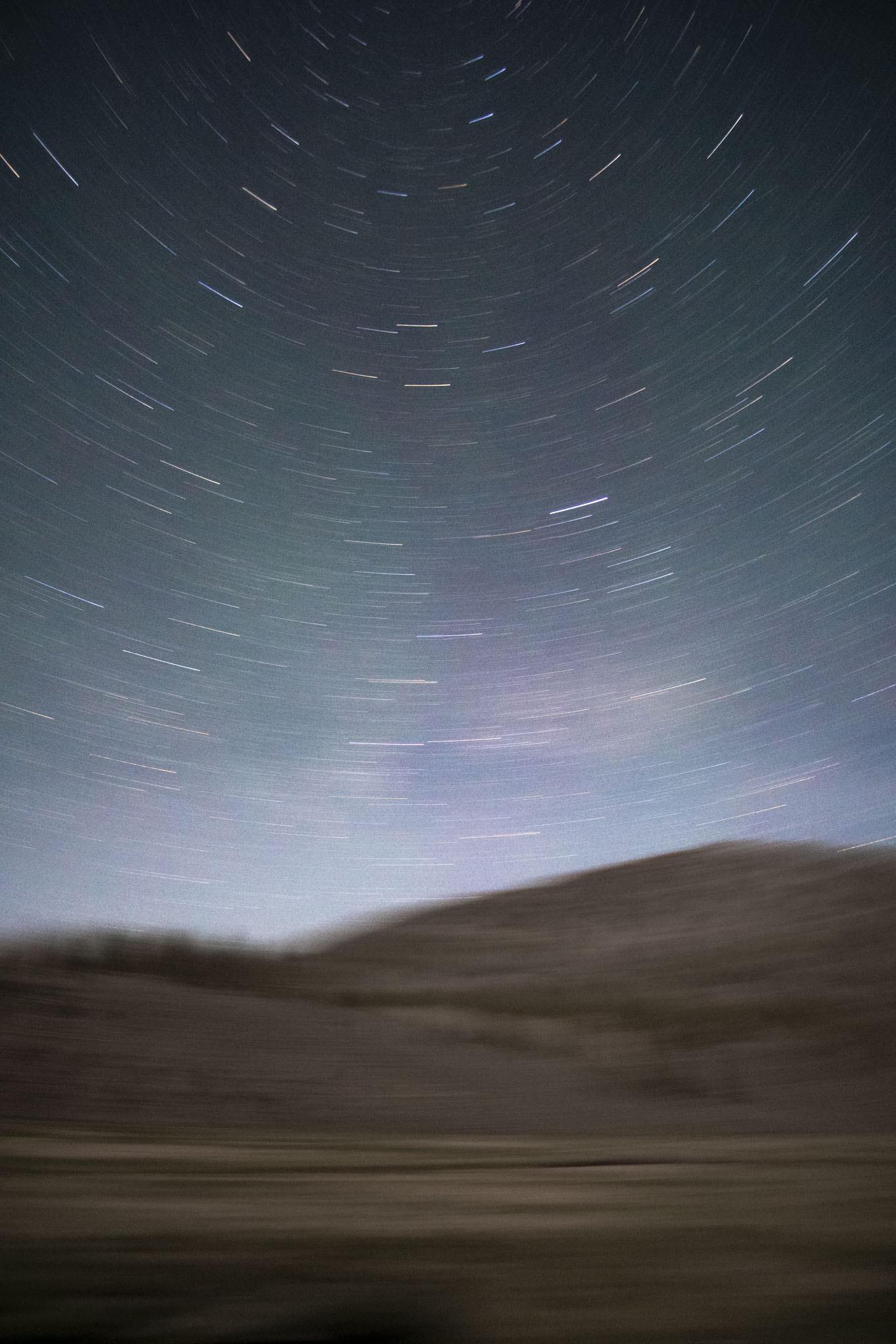 The stars drag in an arc, the foreground is blurry